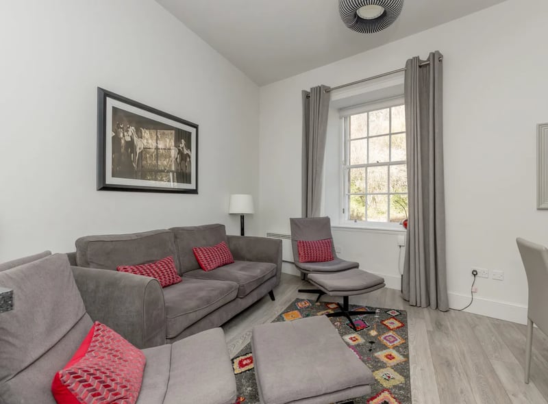 The spacious living space is boosted by curtains and light fittings which come with the property 