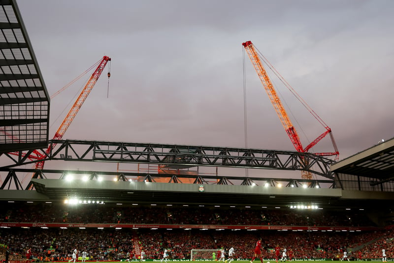 Construction cranes are seen high above the Anfield Road End as a result of a new stand being built throughout the season. (Photo by Clive Brunskill/Getty Images)