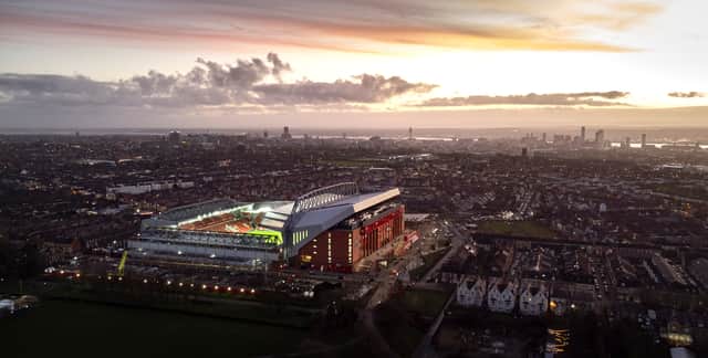 Anfield is illuminated by floodlights as twilight falls on the city of Liverpool in the background. (Photo by Michael Regan/Getty Images)