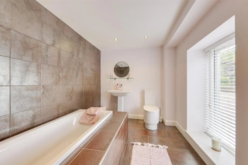 A beautiful en-suite with a bathtub.