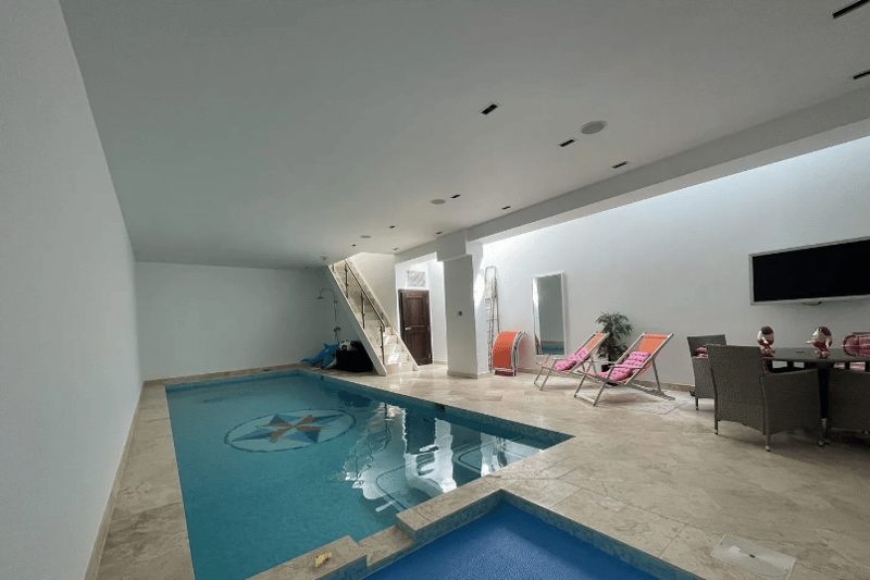 This indoor swimming pool also features a sitting area so you can dry off and relax after a swim