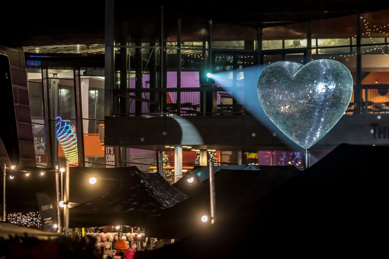 Our Beating Heart consists of more than 11,000 mirrored tiles slowly rotating as a giant heart shaped sculpture. Photo: Chris Payne