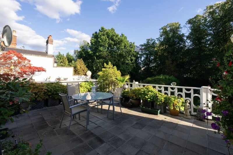 The property boasts a large terrace overlooking a beautiful garden.