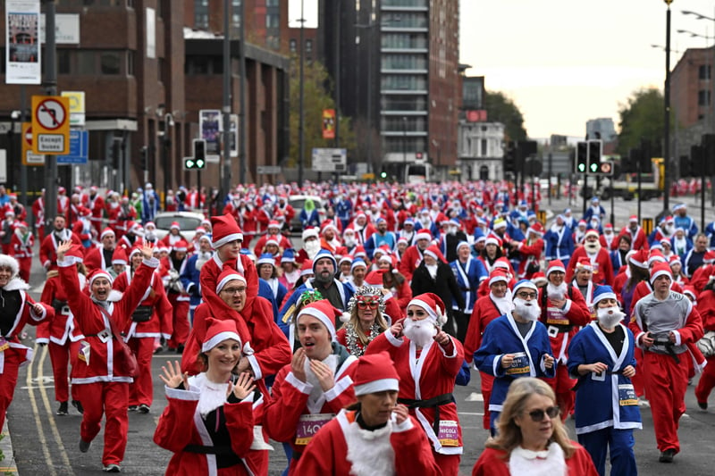 The Liverpool Santa Dash is the biggest and longest established Santa Run in the UK. (Photo by OLI SCARFF/AFP via Getty Images)