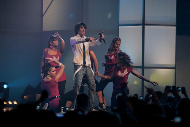 Singer BassHunter (C) performs on stage during "The Dome 41" music show at the SAP Arena 