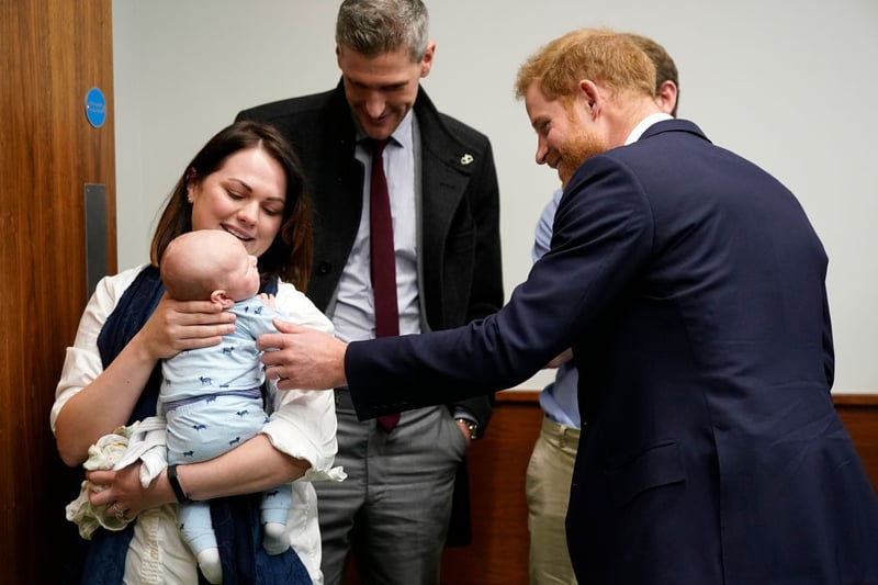 Prince Harry, Duke of Sussex meets Baby James Chalmers, aged five weeks and his mother Kornelia during his tour of The Institute of Translational Medicine at Queen Elizabeth Hospital, on March 04, 2019 in Birmingham, England.  (Photo by Christopher Furlong - WPA Pool/Getty Images)