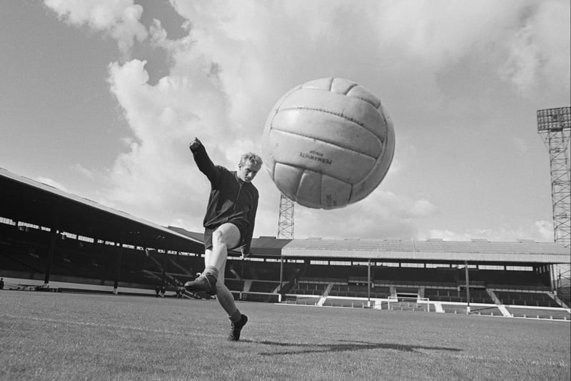 By the end of the 1950s floodlights had also been installed. This can be seen clearly in this shot of Denis Law training on the pitch in 1963. Photo:  Terry Fincher/Daily Express/Hulton Archive/Getty Images