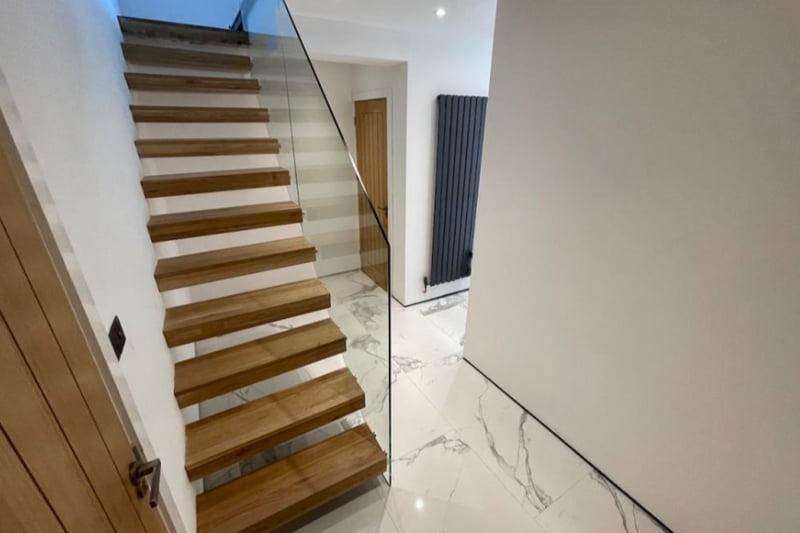 Step inside this stunning five-bed property, with marble flooring and modern fixtures throughout - including a floating staircase.