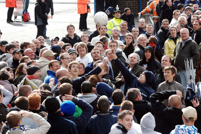 Queueing fans hopeful of attending the Whites’ play-off final entertain themselves with a football in 2008.