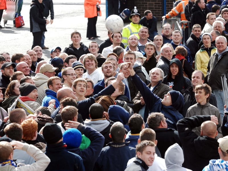 Queueing fans hopeful of attending the Whites’ play-off final entertain themselves with a football in 2008.