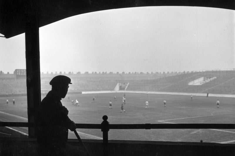 This atmospheric shot shows a member of the ground staff watching City players train at the ground in 1951. Photo: John Chillingworth/Picture Post/Hulton Archive/Getty Images