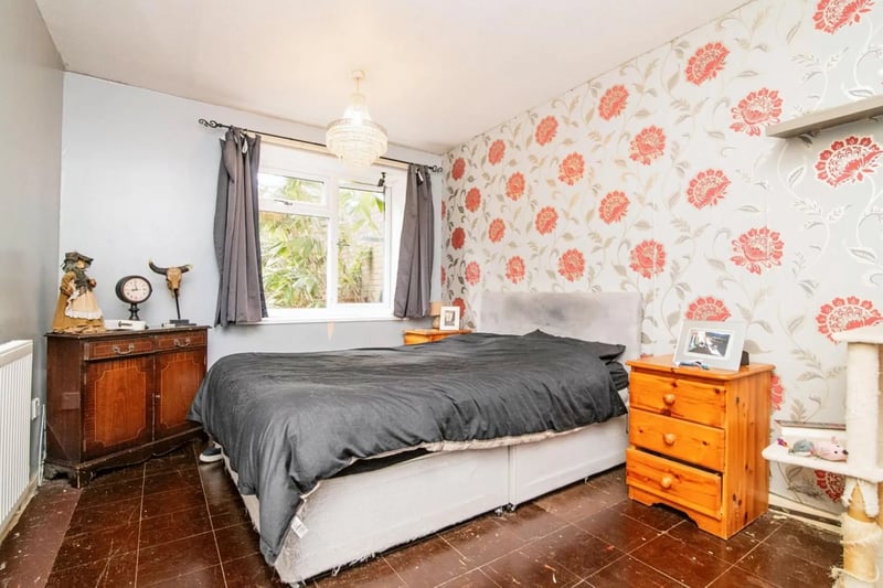 The bedroom has an unusual, but quirky tiled floor. 