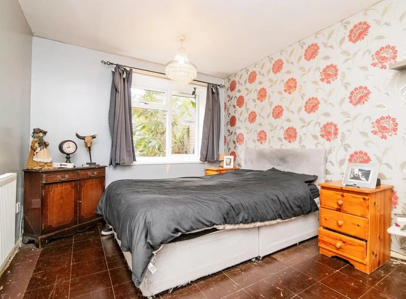 The bedroom has an unusual, but quirky tiled floor. 