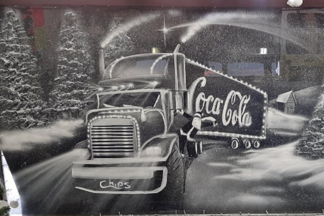 The famous Coca Cola Christmas truck included in a window display