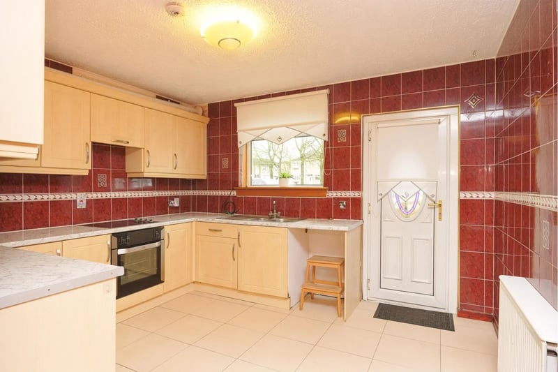Up from the first bedroom there is a lovely fitted kitchen with access to a private rear garden
