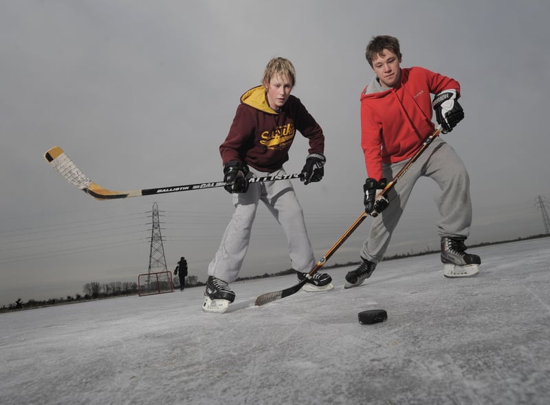 Jack Wicks then (15) and Daniel Swan then (15) shape up their ice hockey skills on the Whittlesey Washes .