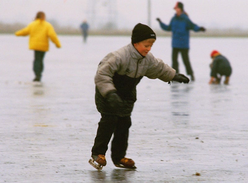 A little boy gets his skates on