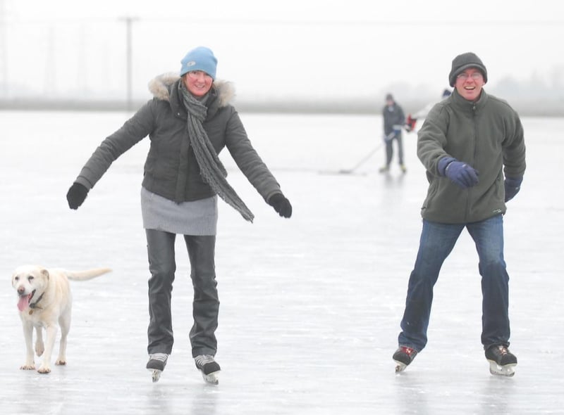  Hugh and Anna Whittome skating with their dog Cara in 2009