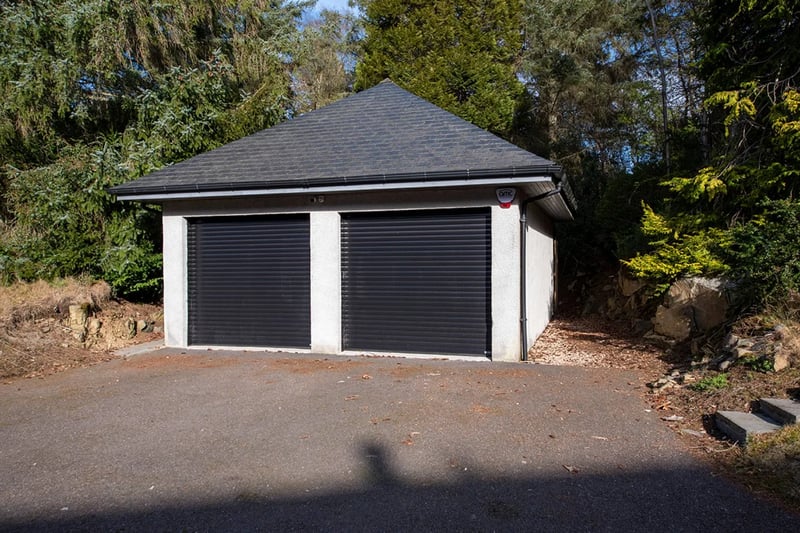 The secure double garage has power, water and light, electrical rollers doors and an alarm system.