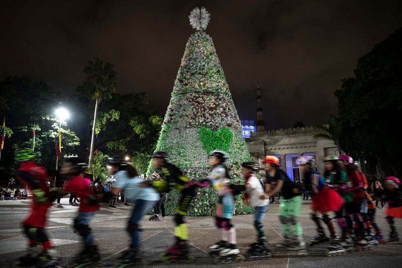 A long running holiday tradition in Venezuela is “las patinatas” - or the skating, where the capital city of Caracas typically roller skates to early morning mass on Christmas Day. Children who live along the skating route will often tie their toe with a piece of string and dangle it outside their window so that when Christmas morning arrives skaters may gently tug on it in order to wake them up and get them skating. 