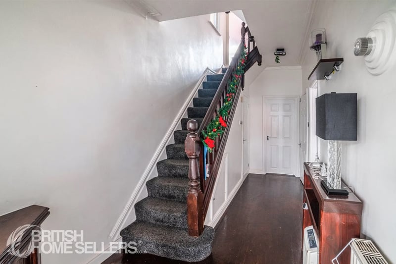 Stairs lead to bedrooms on first floor
