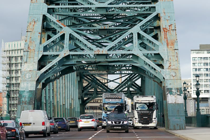 A convoy of lorries and other vehicles cross the Tyne bridge as they take part in a go-slow driving protest against fuel costs on November 20, 2021.