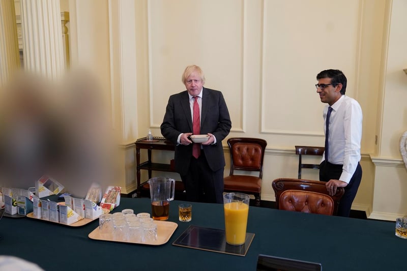 Boris Johnson was already under-fire over lockdown gatherings at Downing Street when Sue Gray published her  report into what has been dubbed ‘Partygate’. 
Police investigated dozens of events across government for alleged Covid breaches during lockdown, including Johnson’s birthday celebration and a gathering in his Downing Street flat.
Both Johnson and Rishi Sunak had received £50 fines over the birthday gathering. This image was included in the Sue Gray report.
Downing Street apologised to Buckingham Palace after it emerged parties were held in Number 10 the day before the Duke of Edinburgh’s funeral the previous year.
A limited version of the report into Whitehall parties during lockdown by Sue Gray was published, criticising a “serious failure” to observe the high standards expected of those working at the heart of government.
