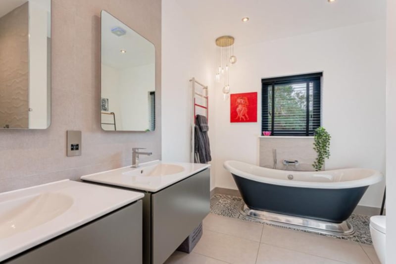 The master en-suite has a stunning standing bath tub.