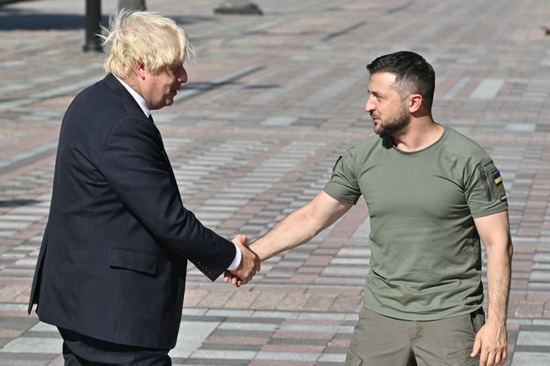 Johnson made the first of three visits to Ukraine while still Prime Minister in April. The visit had not been announced prior to his arrival, was revealed in a Twitter post by the Embassy of Ukraine to the UK.
The post simply read: “surprise” followed by a winking emoji, and contained an image of Johnson and Zelensky sitting opposite each other at a table.
Johnson had been vocal in his support for Zelensky and Ukraine.
He made a surprise second trip to Ukraine in June. In August, just weeks before he left office Johnson returned and visited Kyiv on Ukraine’s Independence Day. He is pictured meeting Zelensky on 24 August.
The invasion of Ukraine by Russia has caused the largest refugee crisis in Europe since the end of the Second World War.
The Homes for Ukraine scheme has seen over 100,000 Ukrainians arrive in the UK since it started in March.