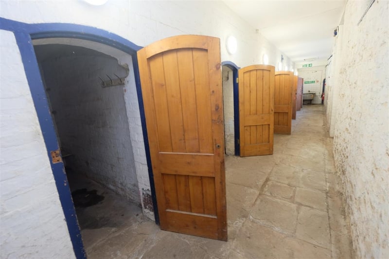 The property comes with a row of cells where detainees were once held.