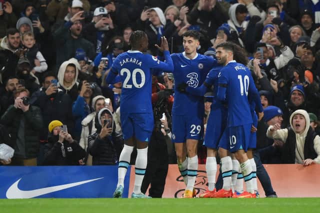Kai Havertz of Chelsea celebrates after scoring their side's first goal with Denis Zakaria and Christian Pulisic during the Premier League match 