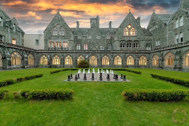 A historic cloister on the grounds used for life-sized chess 