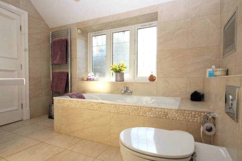 En-suite bathrooms feature a bathtub, toilet and sink. 