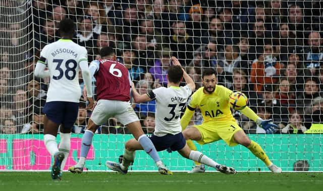Douglas Luiz of Aston Villa scores their sides second goal past Hugo Lloris of Tottenham Hotspur during the Premier League match