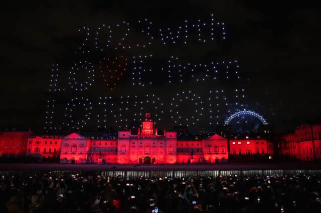 Drones spelled out "2023 with love from London" as fireworks exploded behind them