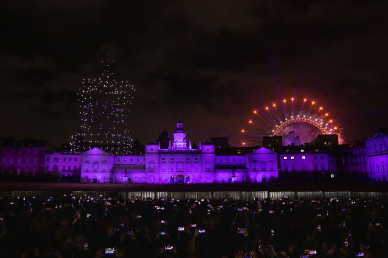 Fireworks and a drone show displaying a crown formation light up the London skyline to celebrate the New Year