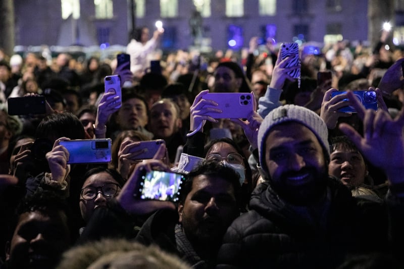 Crowds filmed the display on their mobile phones