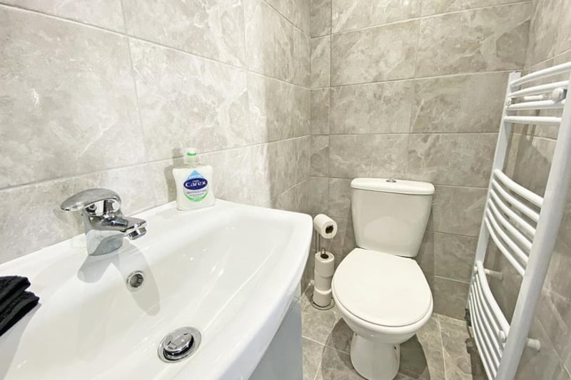 The second en-suite features a toilet, sink, shower and heated towel rack.