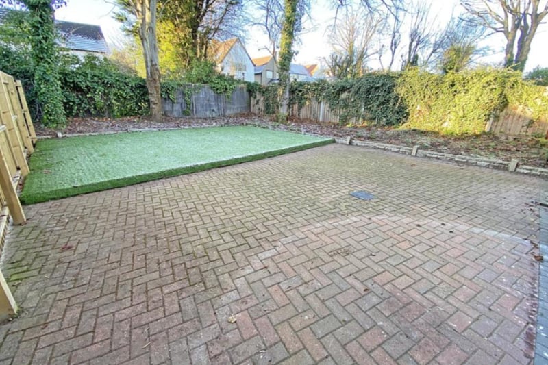 The rear garden has ample space and could be perfect for entertaining.