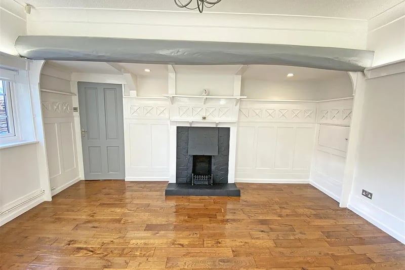 A living space with a fire place in the Blundell Road, Hightown property