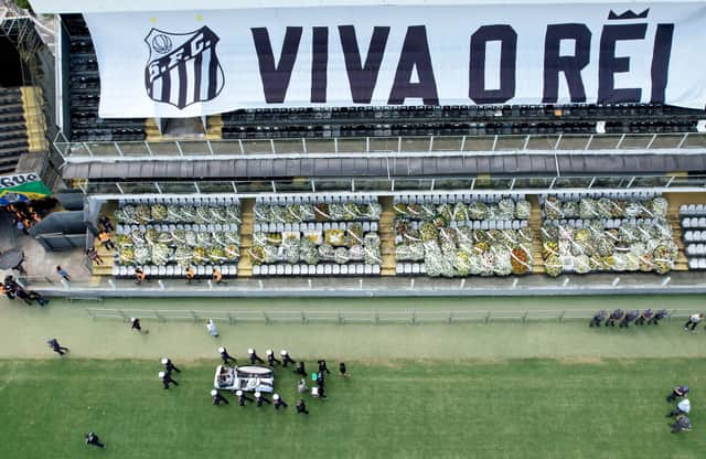 The coffin of Pele leaves Santos’ Vila Belmiro stadium. Credit: Wagner Meier/Getty Images