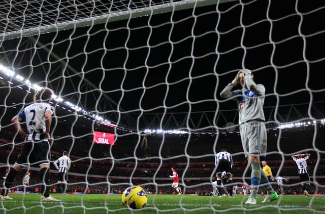 Tim Krul of Newcastle United reacts after Theo Walcott of Arsenal scores their fourth goal during the Barclays Premier League match between Arsenal and Newcastle United at the Emirates Stadium