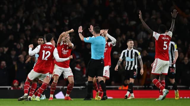 Arsenal players appeal to Referee Andy Madley during the English Premier League football match between Arsenal and Newcastle United