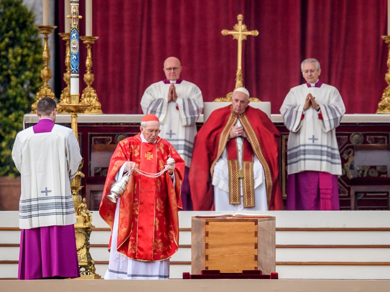 Cardinal Giovanni Battista Re swings a thurible of incense on the coffin of Pope Emeritus Benedict XVI during the funeral mass at St. Peter’s square