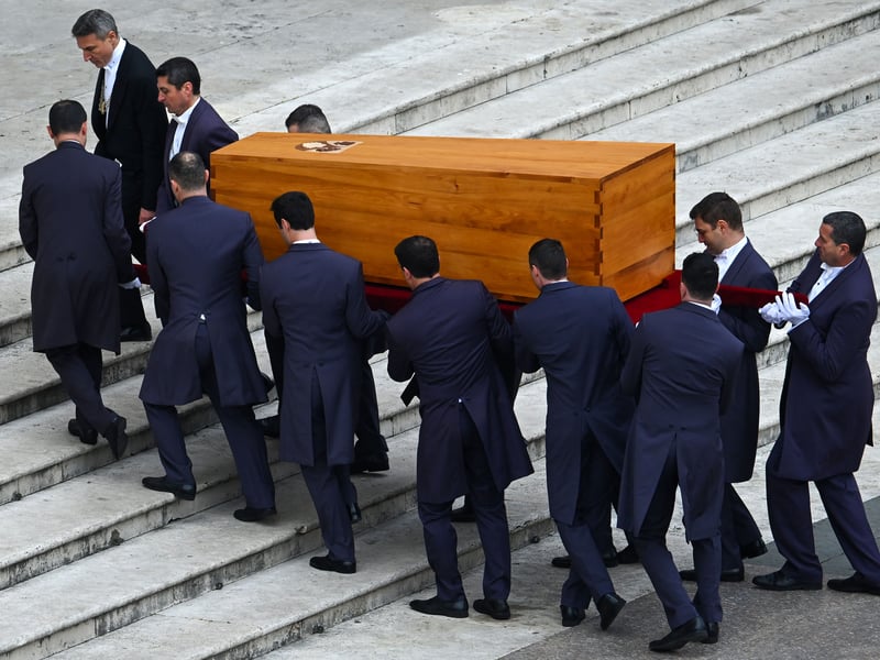 Pallbearers carry away the coffin of Pope Emeritus Benedict XVI at the end of his funeral mass at St. Peter’s square in the Vatican