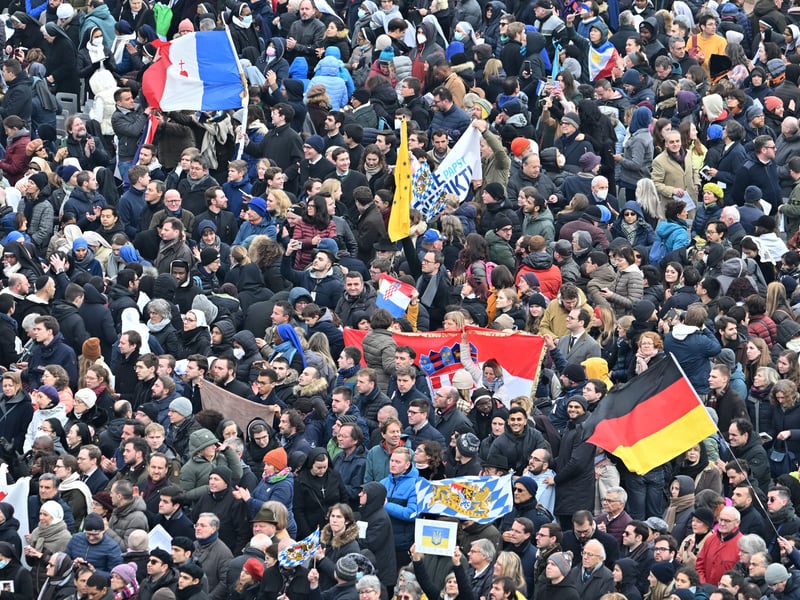 Faithful attend during the funeral mass of Pope Emeritus Benedict XVI at St. Peter’s square in the Vatican