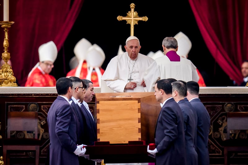 Pope Francis attends the funeral mass for Pope Emeritus Benedict XVI as pallbearers carry the coffin