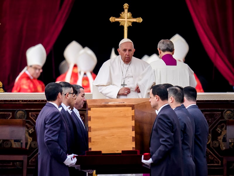 Pope Francis attends the funeral mass for Pope Emeritus Benedict XVI as pallbearers carry the coffin