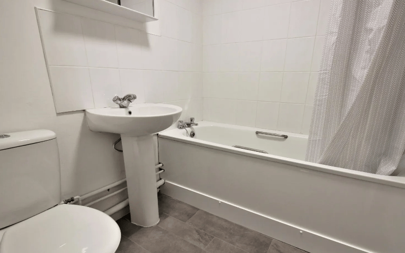 The final image shows the bathroom, complete with a wide bath and modern flooring which wouldn’t need to be replaced, saving a lot of money
