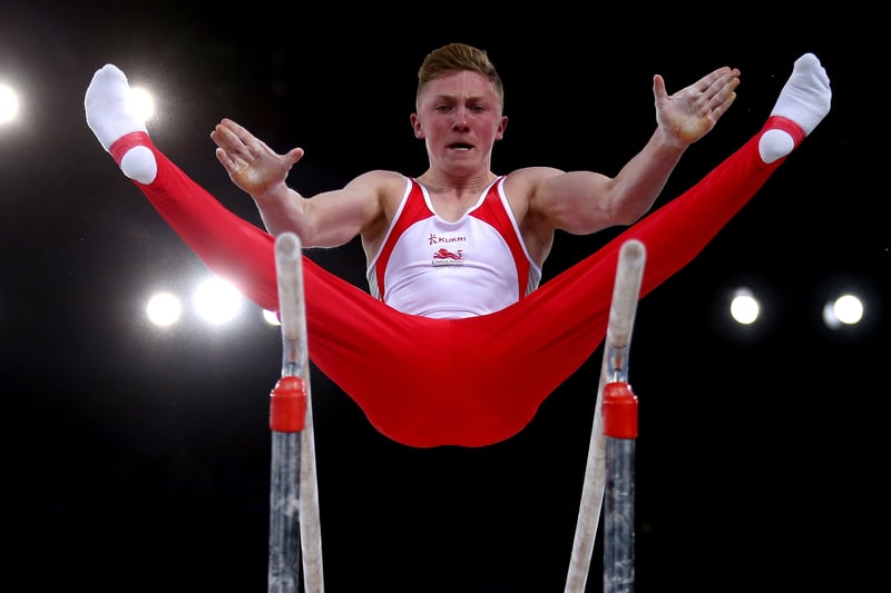 Nile Wilson secured a silver medal in the parallel bar at the Commonwealth Games Glasgow 2014 with a score of 15.433.